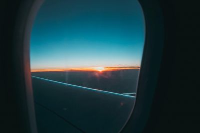 sunset through plane window 