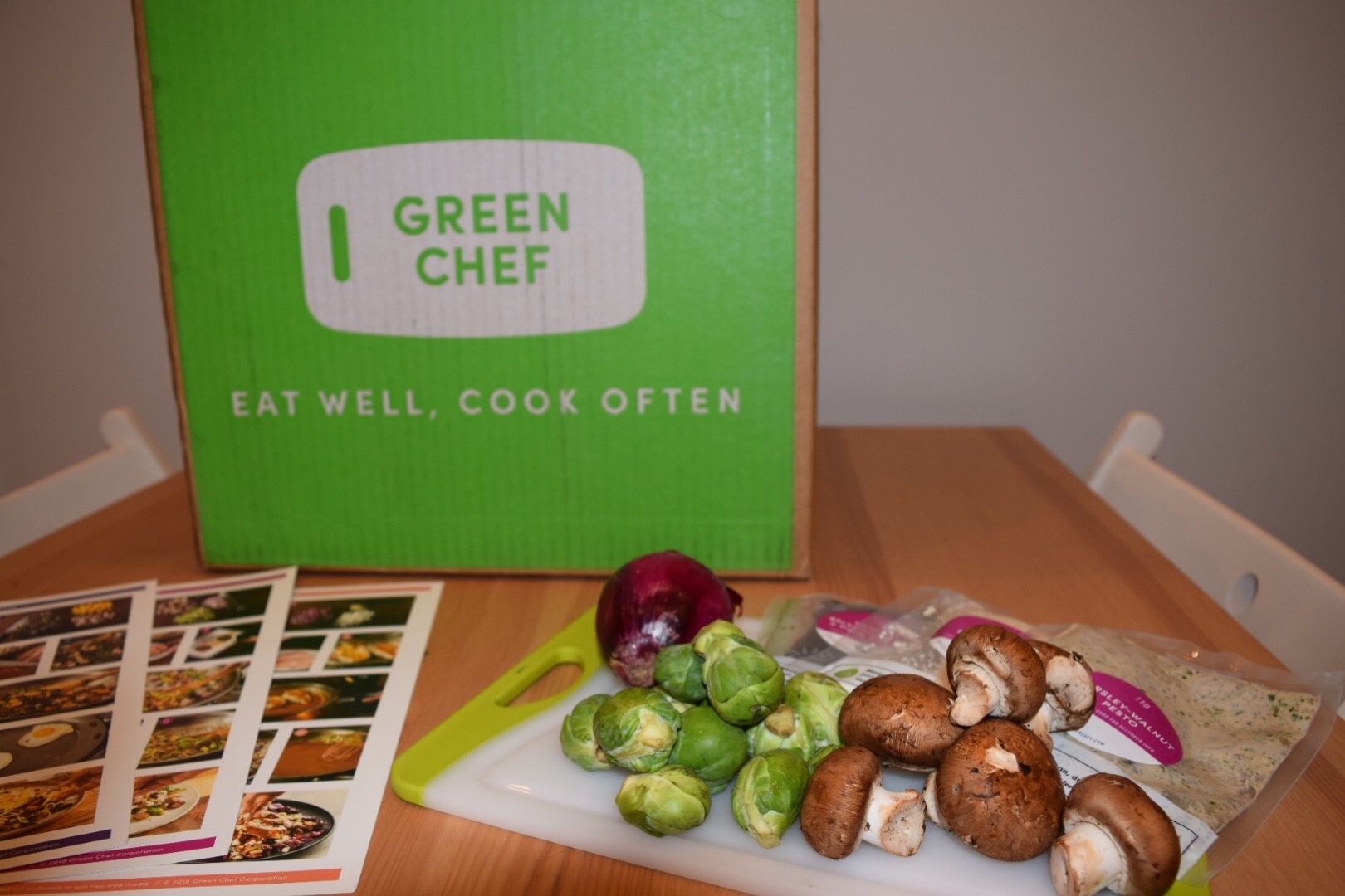 A Green Chef box next to fresh veggies