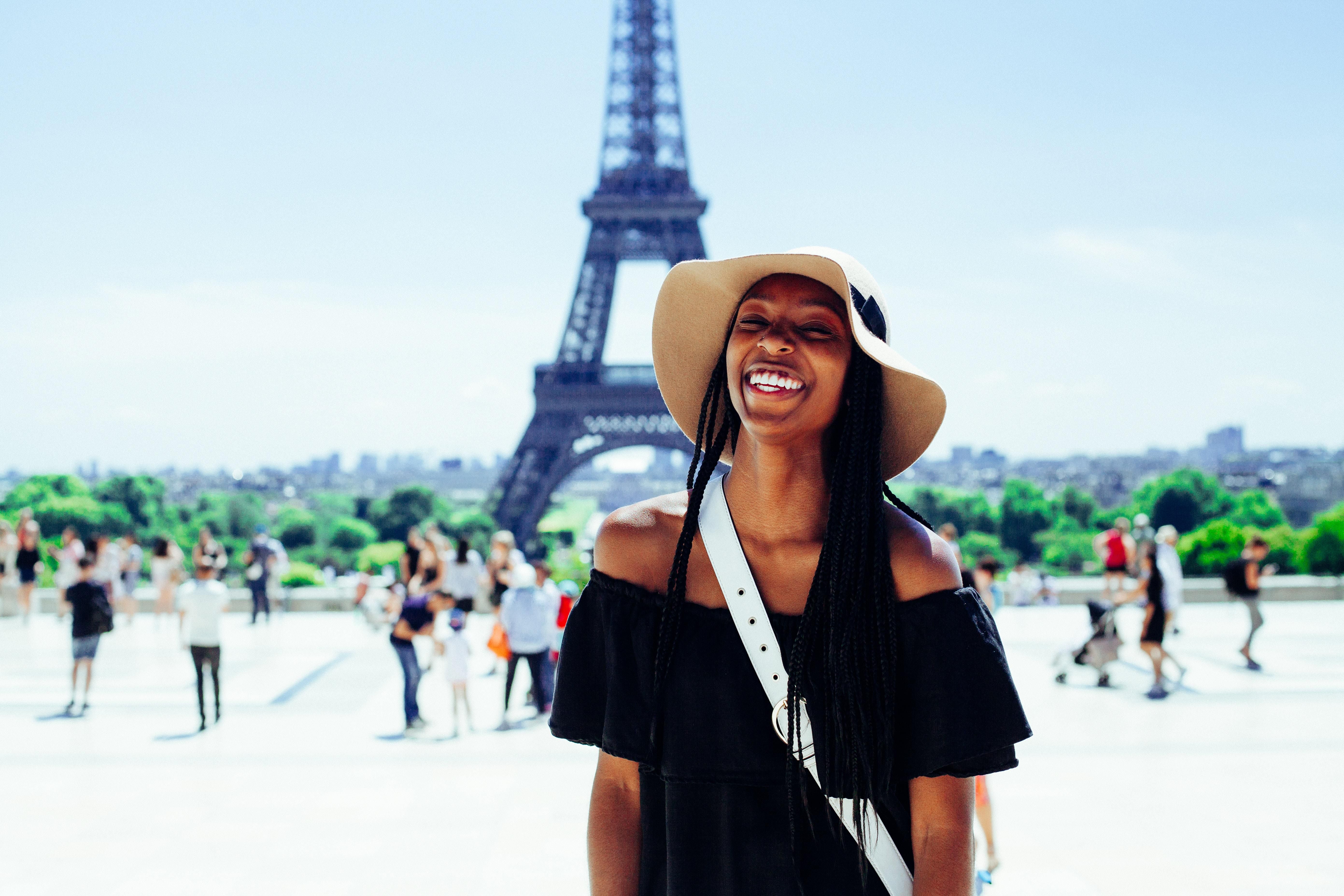 woman in front of eiffel tower