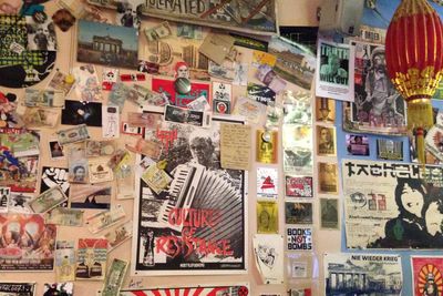 Wall of fliers and money from around the world
